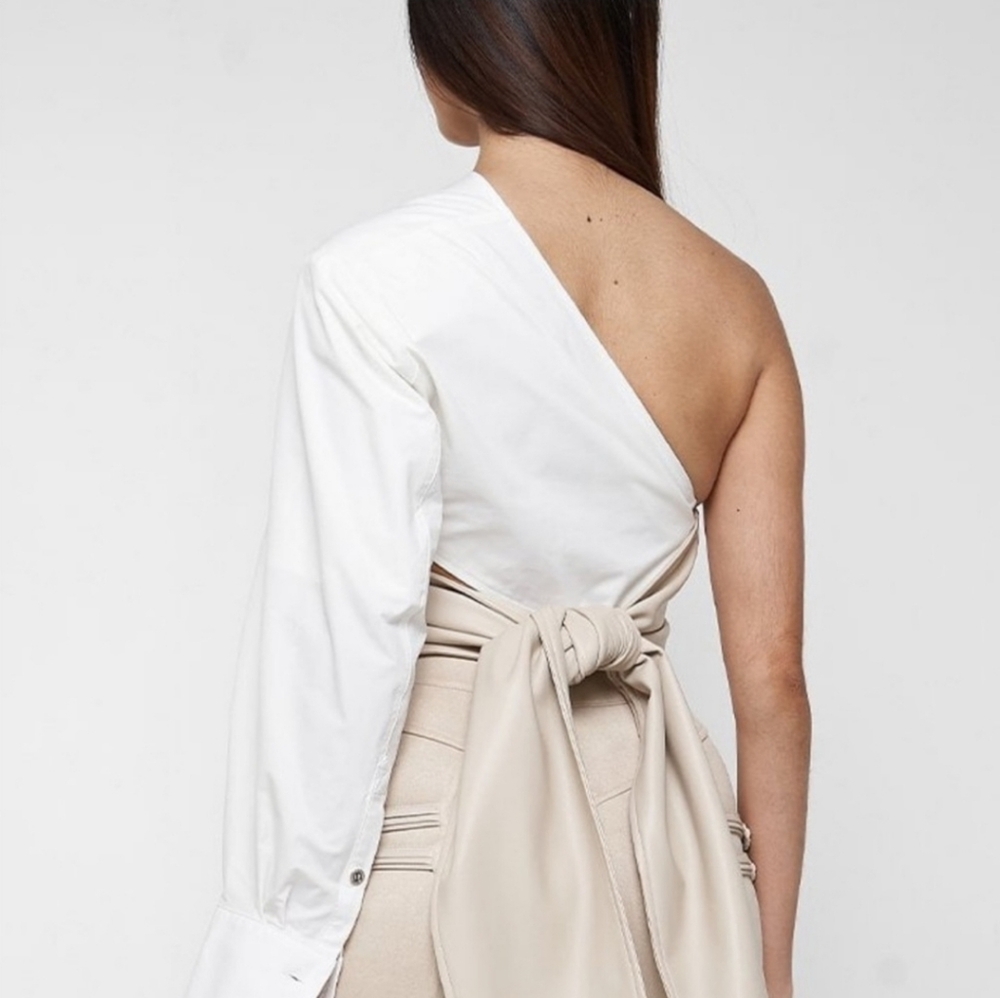 Maniere de voir one sleeve vegan leather wrap top